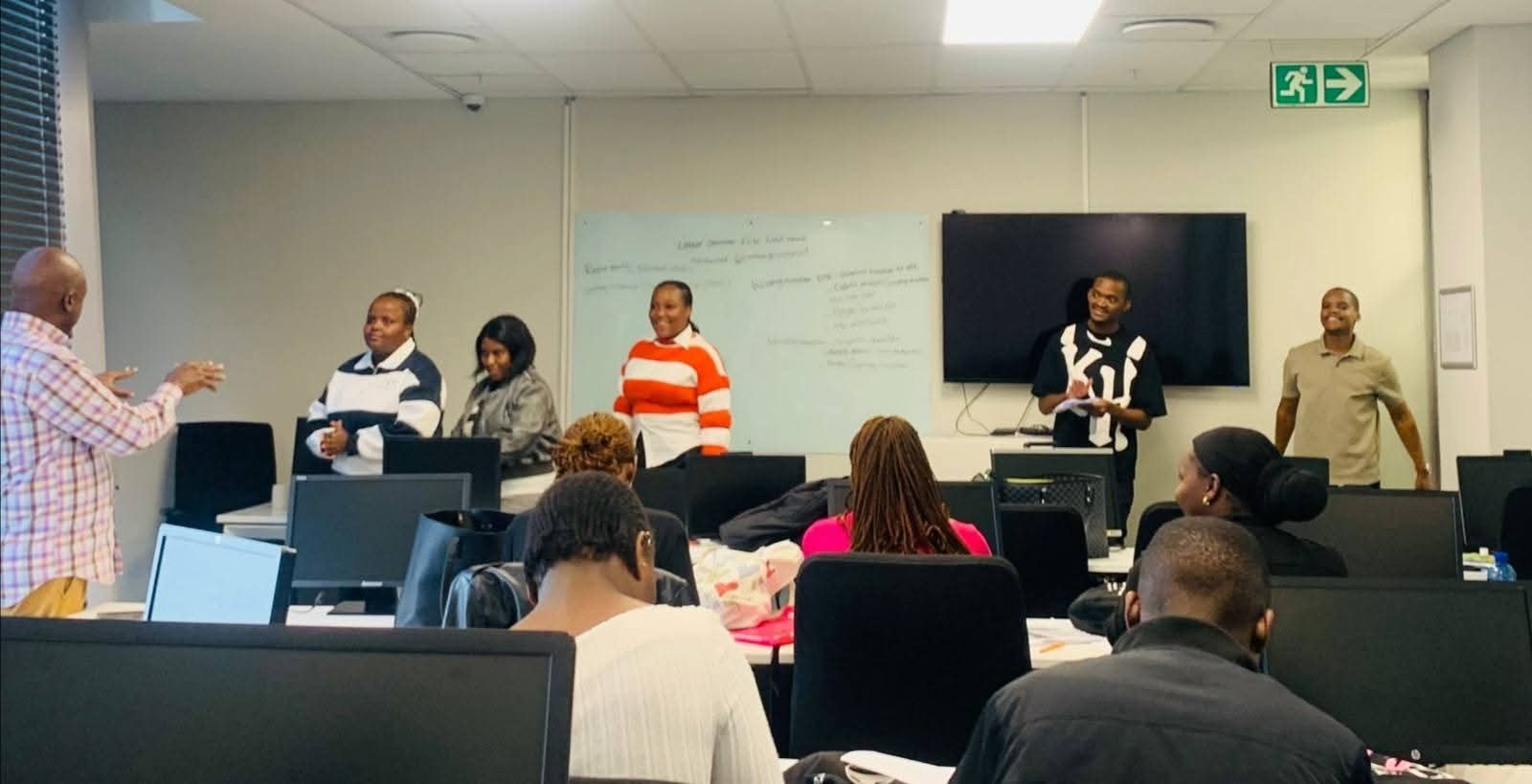 Learners participating in a professional presentation session